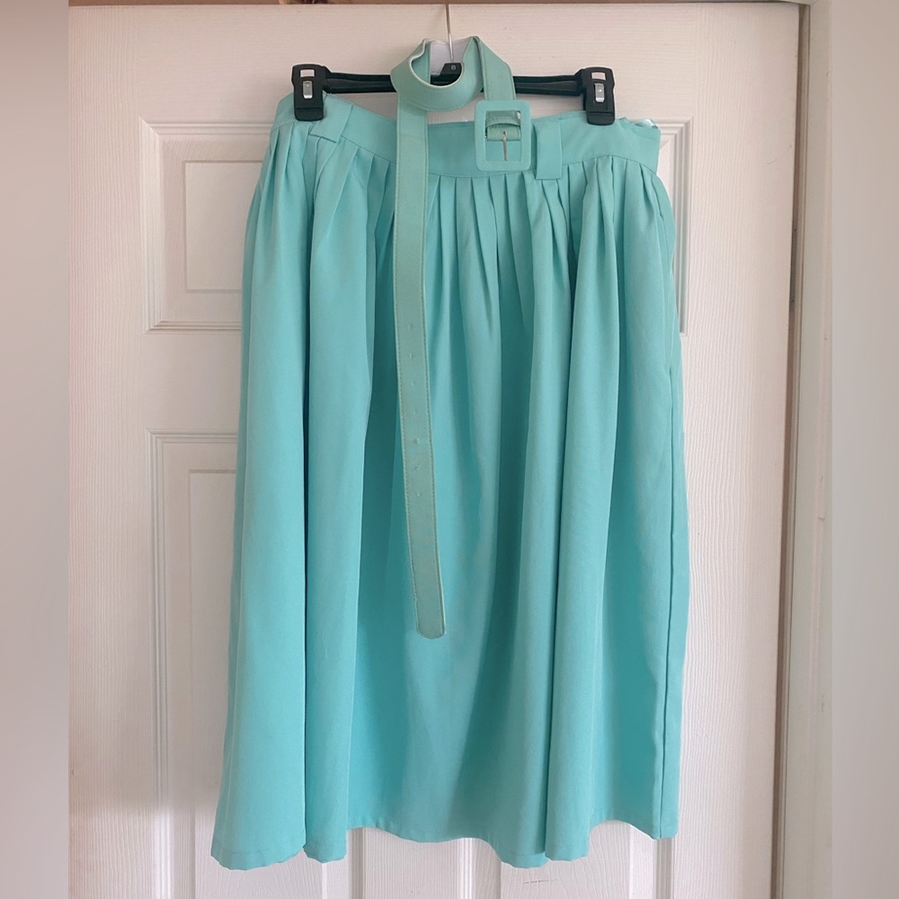 Semi flare skirt with pockets. Belt loops and belt